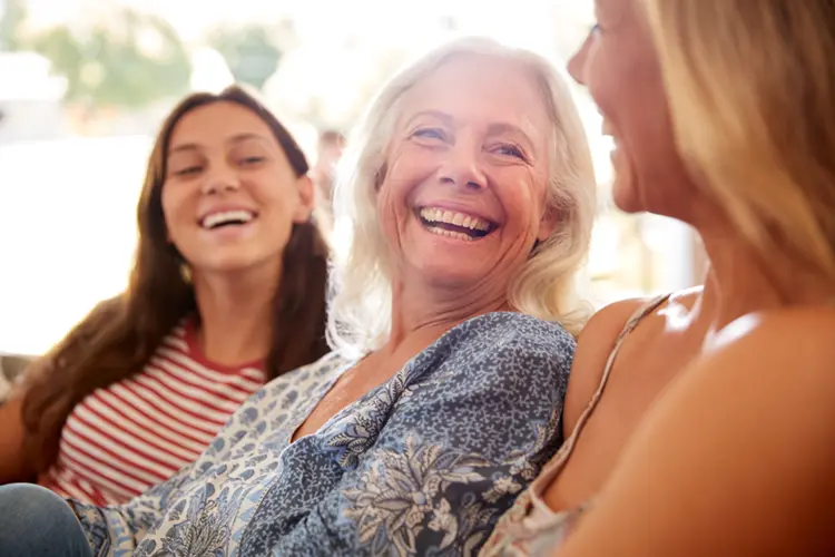 Women enjoying time together — social connection and reduced isolation support gut-brain health in IBS